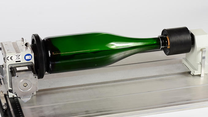 Laser engraving cylindrical objects, wine bottles